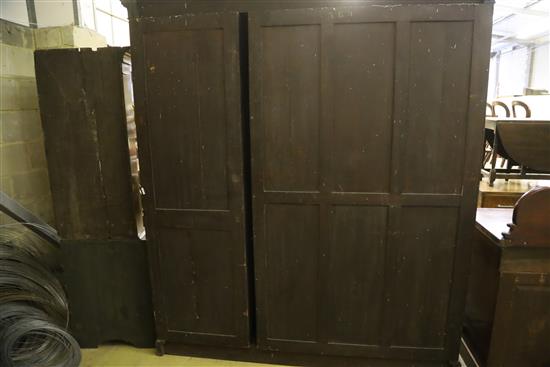 An Edwardian mahogany and boxwood line inlaid two door compactum wardrobe, W.194cm, D.61cm, H.215cm